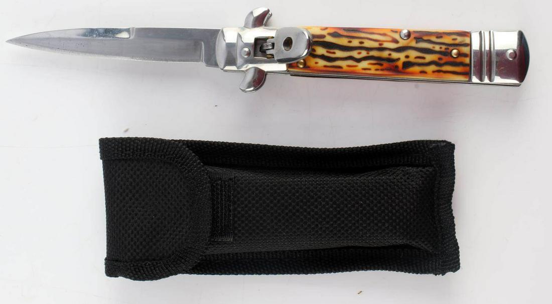SPRING ACTION LOCKING SWITCHBLADE KNIFE STAG GRIP: Spring action switchblade knife with simulated stag grip. Measures 7 3/4 inches. Very good condition.