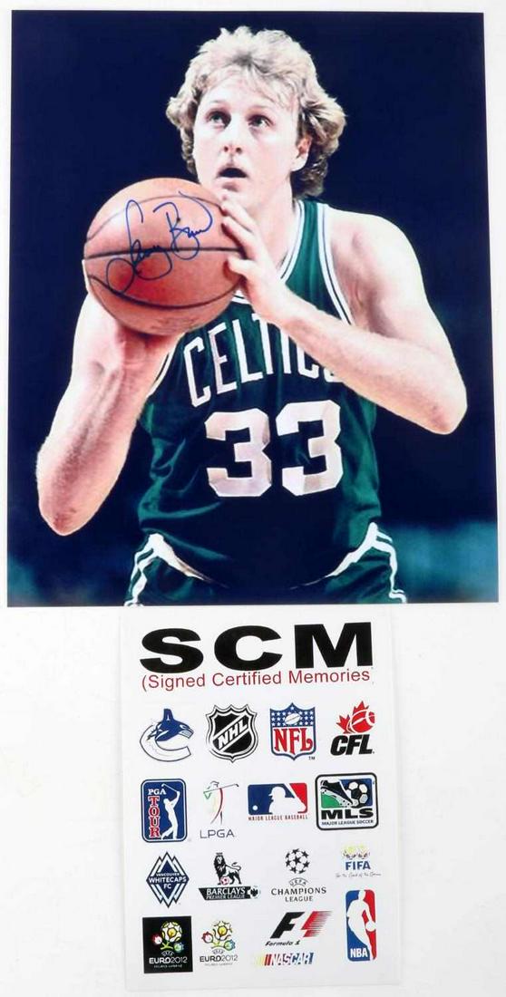 LARRY BIRD SIGNED 8X10 AUTOGRAPHED PHOTO WITH COA: Certification issued by SCM (Signed Certified Memories). Photo measures 8x10 inches.