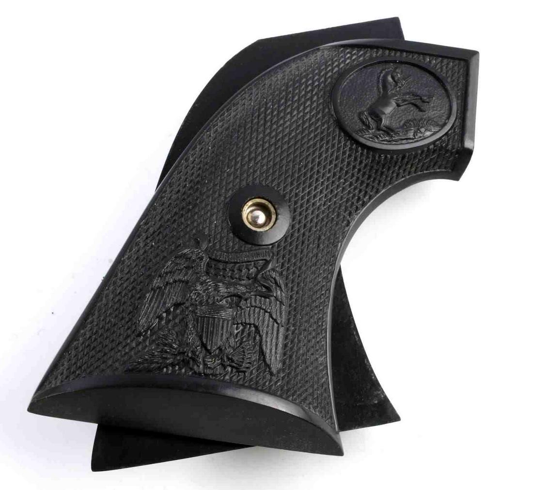 ORIGINAL COLT FACTORY CHECKERED SINGLE ACTION GRIP: With screw, composite , very good original colt, measured along the curve 4 3/4 inches.