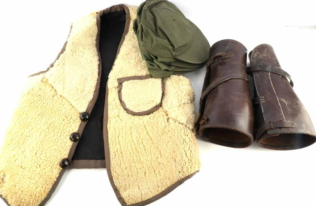 PAIR OF WWI U.S. ARMY LEATHER PUTTEES & WOOL VEST: Pair of WWI U.S. Army Leather Puttees / Gaiters & Wool Vest. Puttees measure approx. 11.5 inches in length and 5 inches in diameter at the top. Brown leather construction, brown threading and 2 buckle