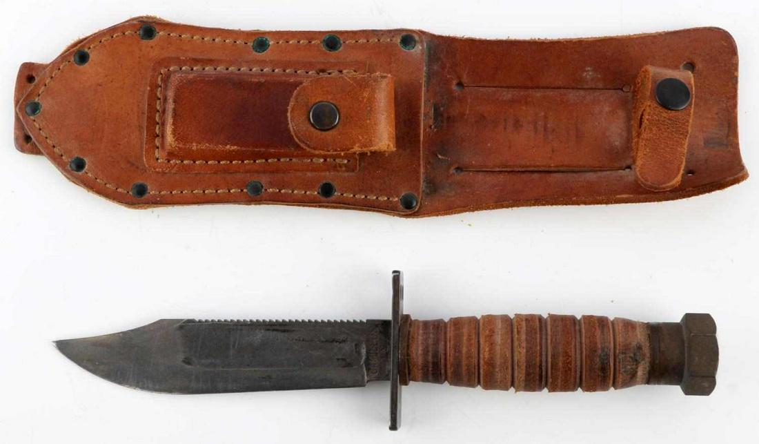VIETNAM CAMILLUS PILOT SURVIVAL KNIFE W SHEATH: Has stone and appears to have been used minimally, knife overall is 9 1/2 inches.