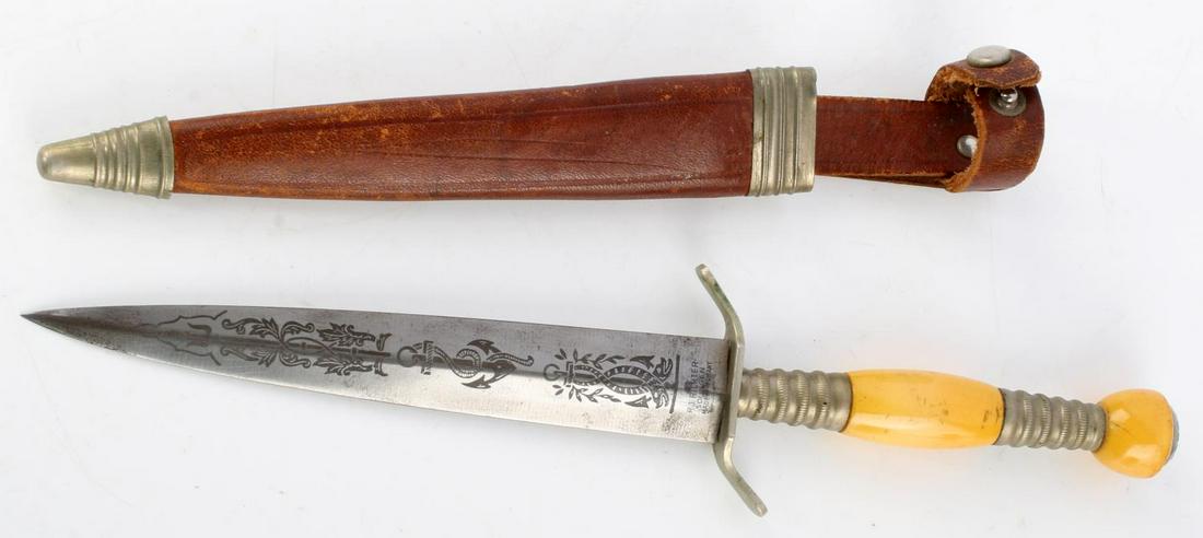 WWII GERMAN NAVY DAGGER BY RJ RICHTER SOLINGEN: Features a 6 1/8 inch blade with embossed design and maker marked to ricasso, sharp tip, yellow bakelite grip with nickel steel fittings. Leather and metal sheath included. Very good condition. Unauth