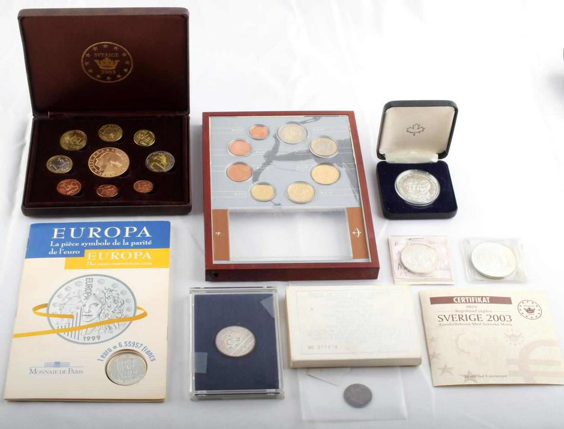 WORLD SILVER & EURO COIN LOT MERK SETS: Grouping includes 1672 Scottish Merk AG, 1983 Diana and Charles Canada, silver dollar, 1981 Yemen silver 25 Riyals, Austria 2002 10 Euros, 2003 Pattern Sweden Euro set, Silver France Europa conversion