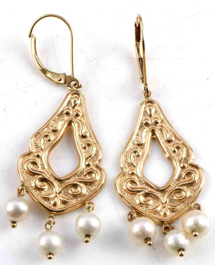 14K YELLOW GOLD AND PEARL DROP STYLE EARRINGS: Lever backs are stamped "14K". Three pearls hang from the bottom of each earring. Each pearl measures 5.42 millimeters. The earrings measure 2 inches long and approximately .75 inch wide. Together ear