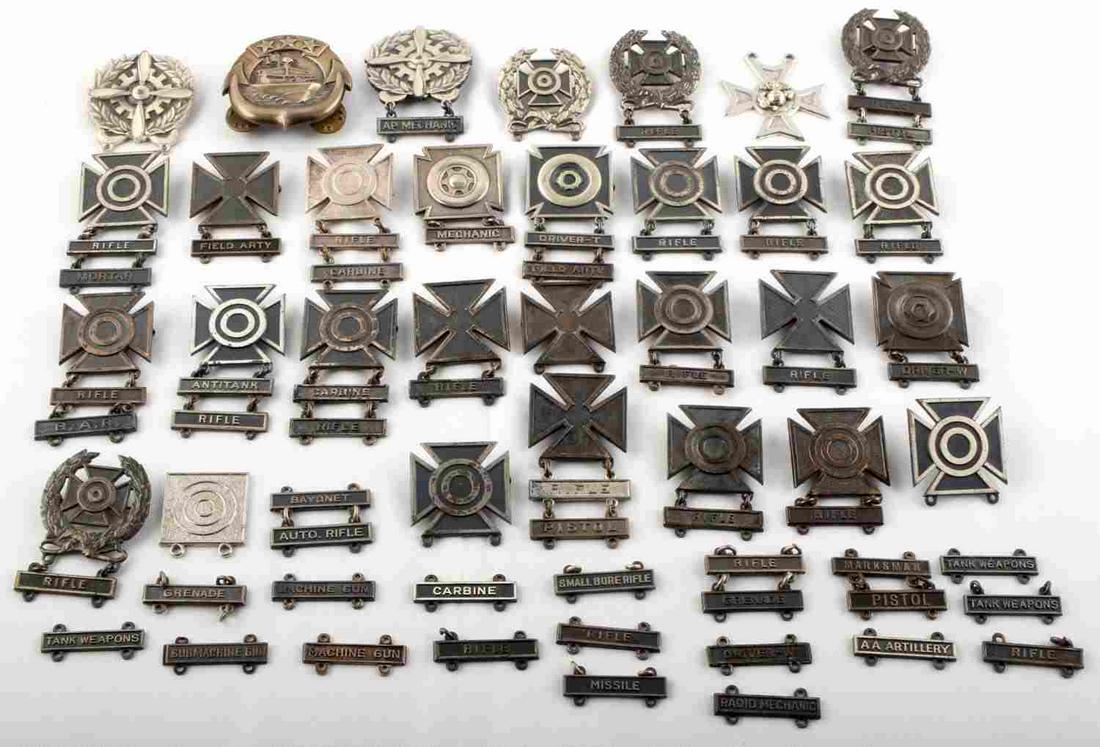 400 GRAMS 12.9 OZT STERLING SILVER MARKSMAN BADGES: Pre WWII to Vietnam, marksman and sharpshooter badges all sterling, Army and USMC includes a USN small craft badge. This lot has a reserve.