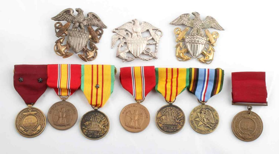 LOT OF 7 MULTI CONFLICT MEDALS AND 3 US NAVY PINS: Variety of medals such as National Defense, Expeditionary Service, Vietnam Service, and Naval Good Conduct. Unnamed and regular sized. USPHS pin with 2 Naval pins. Makers include Viking, Vanguard, and