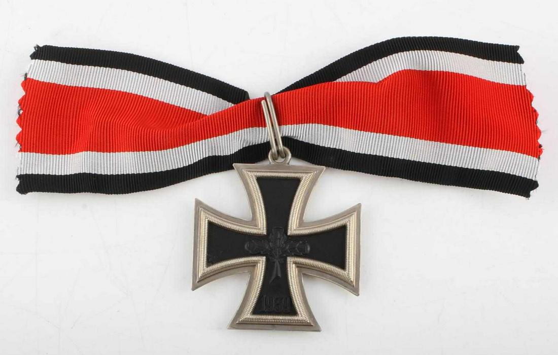 POST WWII GERMAN VETERAN KNIGHTS IRON CROSS: 2 piece frame with iron core. Cross has oak leaf in center with 1939 on lower obverse arm. Jump loop above housing ribbon. Measures 2 inches. This lot has a reserve.