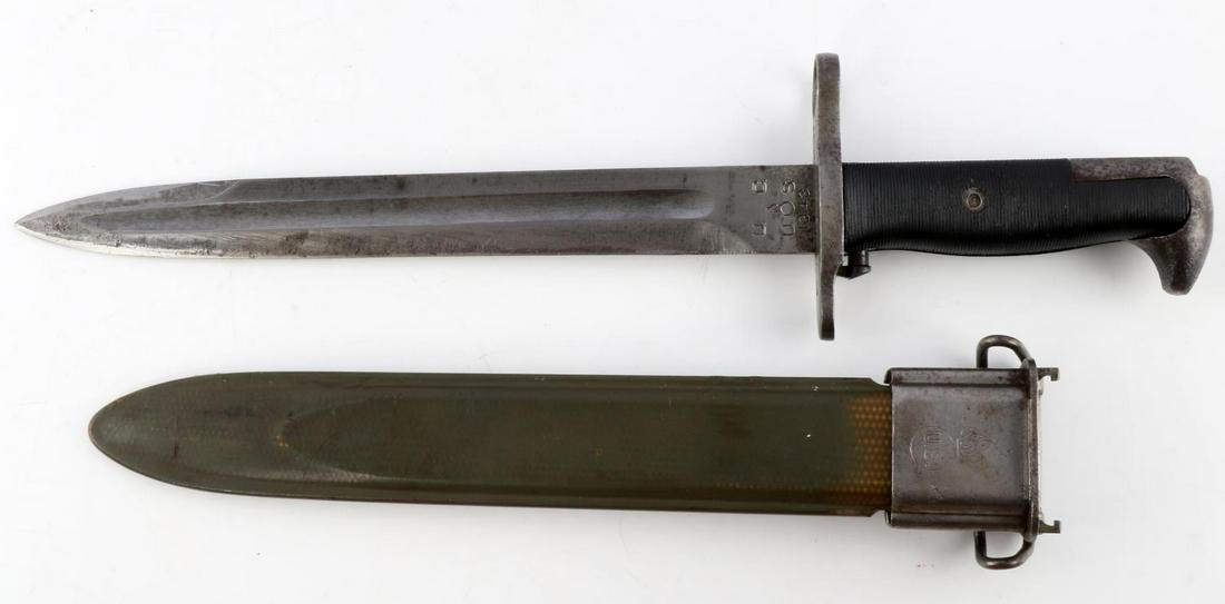 WWII USMC US MODEL 1942 ORDINANCE BAYONET: Model 1942 bayonet with ordinance marks. Steel blade with black grip and green scabbard. Blade and scabbard both have ordinance mark. Blade also marked U.C. and 1943. Measures 15 3/4 inches. This lot 