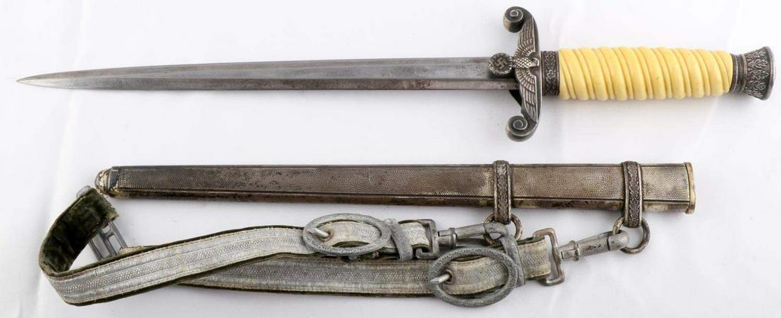 WWII GERMAN REICH HEER ARMY DAGGER & SCABBARD: WWII German Reich Heer Army dagger & scabbard in good condition. Blade measures about 10 3/16 inches long in total, and possesses some scratching and service wear. Crossguard and pommel show significa