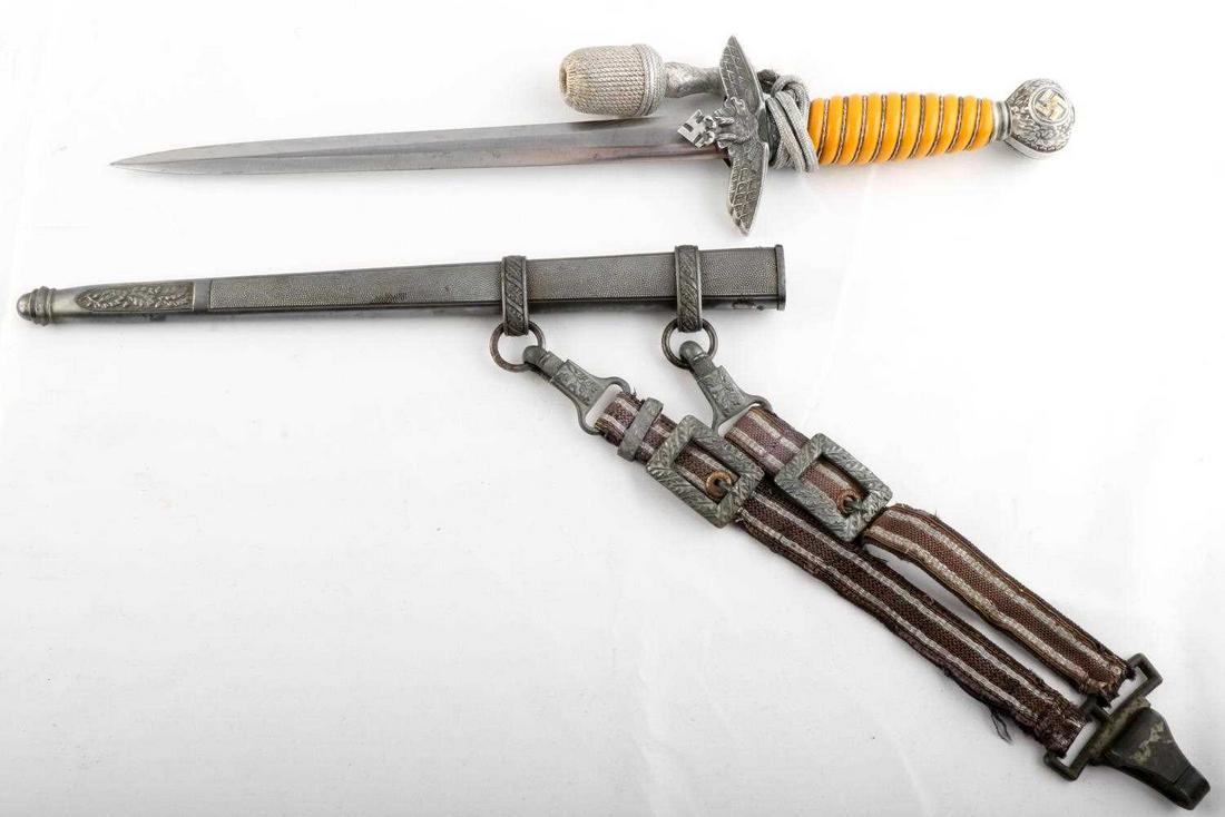 WWII GERMAN REICH 2ND PATTERN LUFTWAFFE DAGGER: With hanger, some fraying DRGM on clip. dent free original scabbard, dagger is tight in scabbard with no play, wired Bakelite grip, tang is unmarked, very good blade with light friction marks, Eickhor