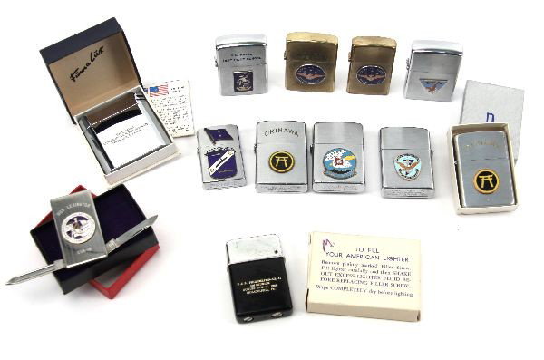 US NAVY LIGHTER COLLECTION BIG VARIETY: A collection of lighters and a money clip. None are Zippos, mostly Vulcan and Penguin, all U.S. Navy themes. Squadrons, 7th fleet , U.S. Naval test pilot school, Okinawa, some duplication. Two are min