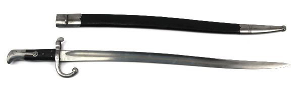 DANISH 1867 MODEL SWORD BAYONET FOR ROLLING BLOCK: A Danish 1867 model sword bayonet for the Danish rolling block rifle. Solingen blade very good condition with scabbard.