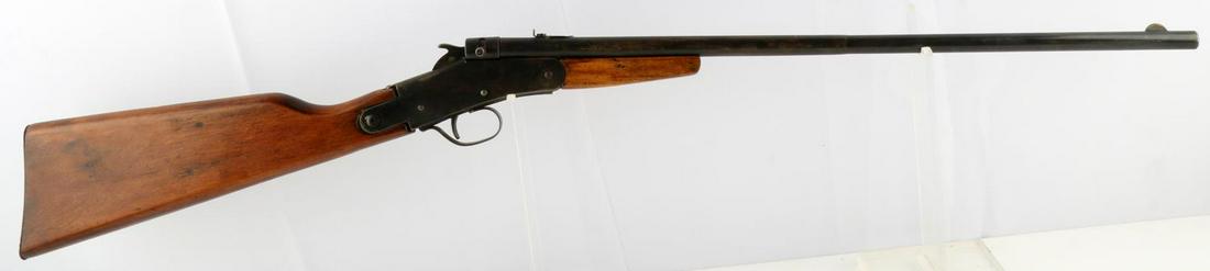 THE HAMILTON RIFLE NO. 027 BOYS YOUTH RIFLE .22: Single shot tip-up boy's rifle, 20.75 inch brass barrel covered in blued sheet metal, seam visible to underside, maker marked to left side, wood stock and metal plate. Blade front and notched rear sig