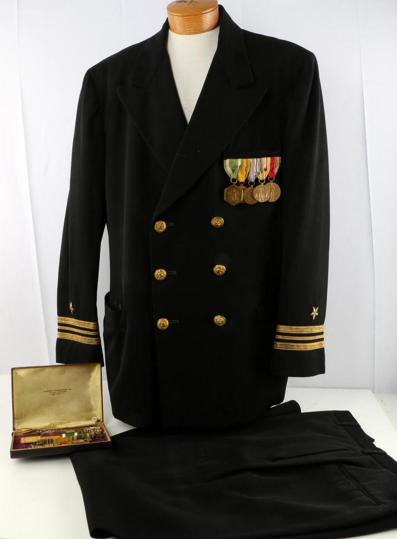 US NAVY LT. COMMANDER DRESS TUNIC UNIFORM W MEDALS: Size large black wool tunic and trousers, gold bullion cuff ranks with star on both sleeves, Sylvan's Norfolk, VA label to inside. 5-pc WWII medal ribbon bar (Military Merit, American Defense, America