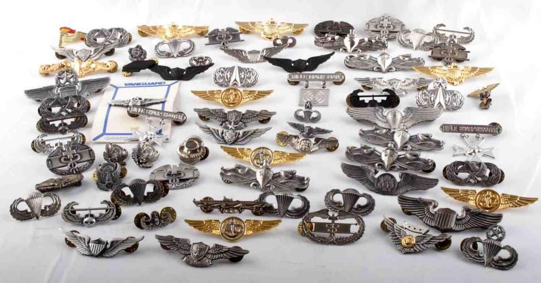 OVER 1 1/2 POUNDS OF WWII TO VIETNAM WINGS & BADGE: Huge variety of Wings WWII and post war, Submariner, Combat Medic, Air Crew, Gunner Airborne , Marksman and so much more, none of the badges are stamped sterling, some silver fill but none sterling.
