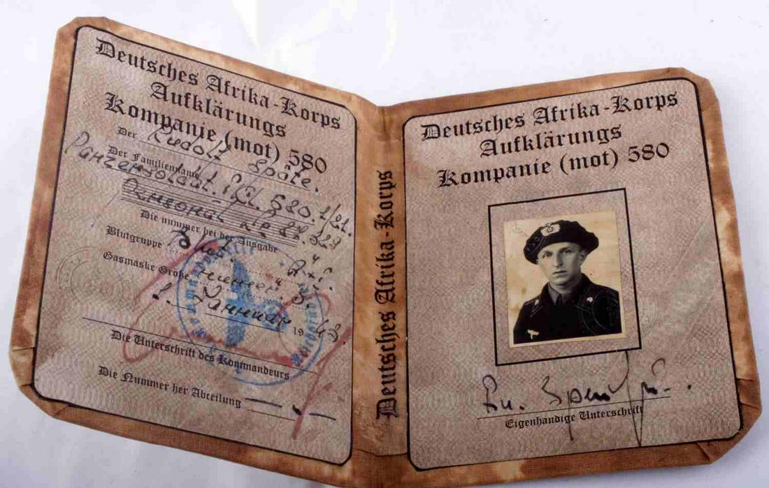 WWII GERMAN 3RD REICH SS ID BOOK AFRIKA PANZER MAN: WWII German Third Reich SS ID Book Afrika Campaign Panzer Man. Measures approx. 5X4.25 inches closed. Measures approx. 5X8.5 inches while open. Purportedly a Waffen SS Afrika Campaign Panzer man ID bo