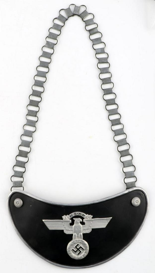 WWII GERMAN THIRD REICH NSKK BEARERS GORGET: NSKK gorget. Features NSKK Reichsadler on black paint with 2 rivets. Dark grey felt on reverse. 2 prongs with RZM M34/2 marked. Measures 8 1/4 inches. Chain measures 24 1/2 inches. Unauthenticated, so