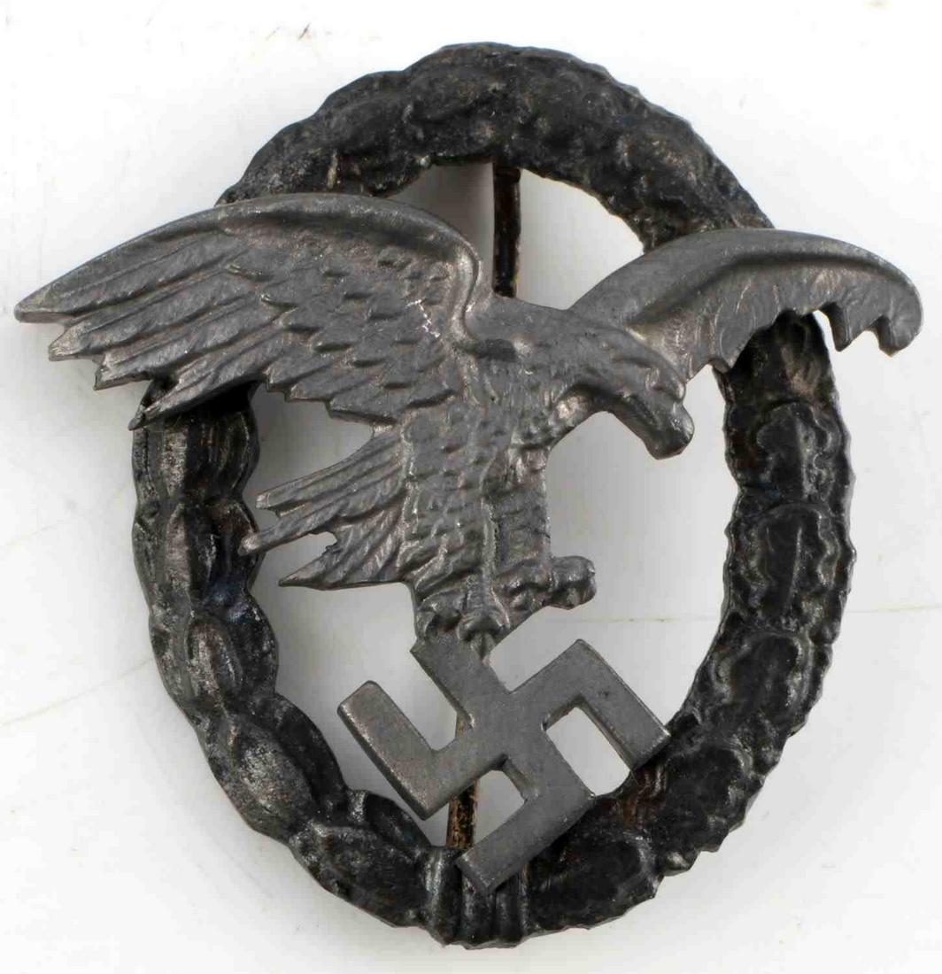WWII GERMAN THIRD REICH LUFTWAFFE PILOT BADGE: Third Reich Luftwaffe pilot badge. Oak and laurel leaf wreath with flying eagle. Zinc construction. Vertical pin with c catch. Measures 2 inches. Very good condition. Unauthenticated, sold as is.