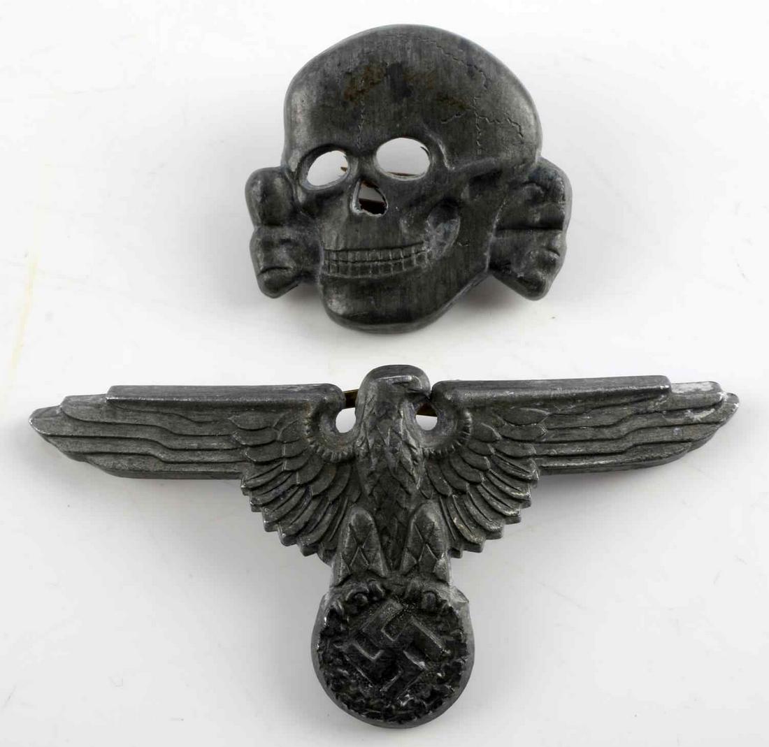 WWII GERMAN THIRD REICH TOTENKOPF SS CAP SET: WWII German Third Reich Parteiadler and Totenkopf SS visor hat pin set. First pin obverse shows eagle emblem, second shows skull. Eagle pin inverse is marked SS475/42. Skull pin inverse is marked SS47