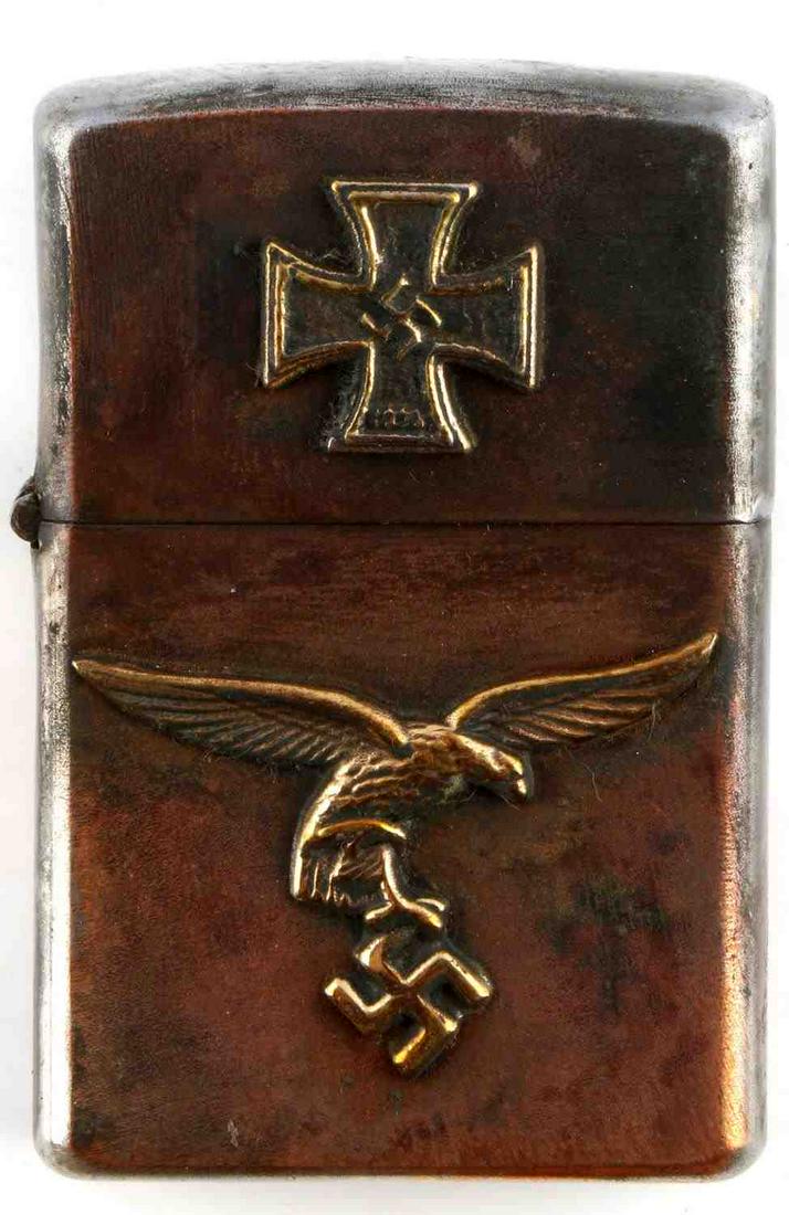 WWII GERMAN THIRD REICH PILOT IRON CROSS LIGHTER: WWII German Third Reich Pilot's Iron Cross Winner's Cigarette Lighter, measures approx. 1.5 X 2.5 inches. Marked "RZM" on the bottom, not tested, opens well and holds closed. Unauthenticated, sold as 
