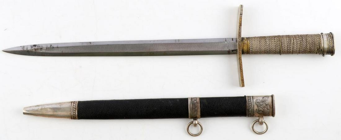 WWII GERMAN THIRD REICH HITLERJUGEND LEADER DAGGER: Third Reich HitlerJugend leader dagger. Steel blade with steel wire wrapped grip, nickel crossguard, and nickel pommel. Leather bound scabbard also with nickel fittings featuring eagle clutching sword