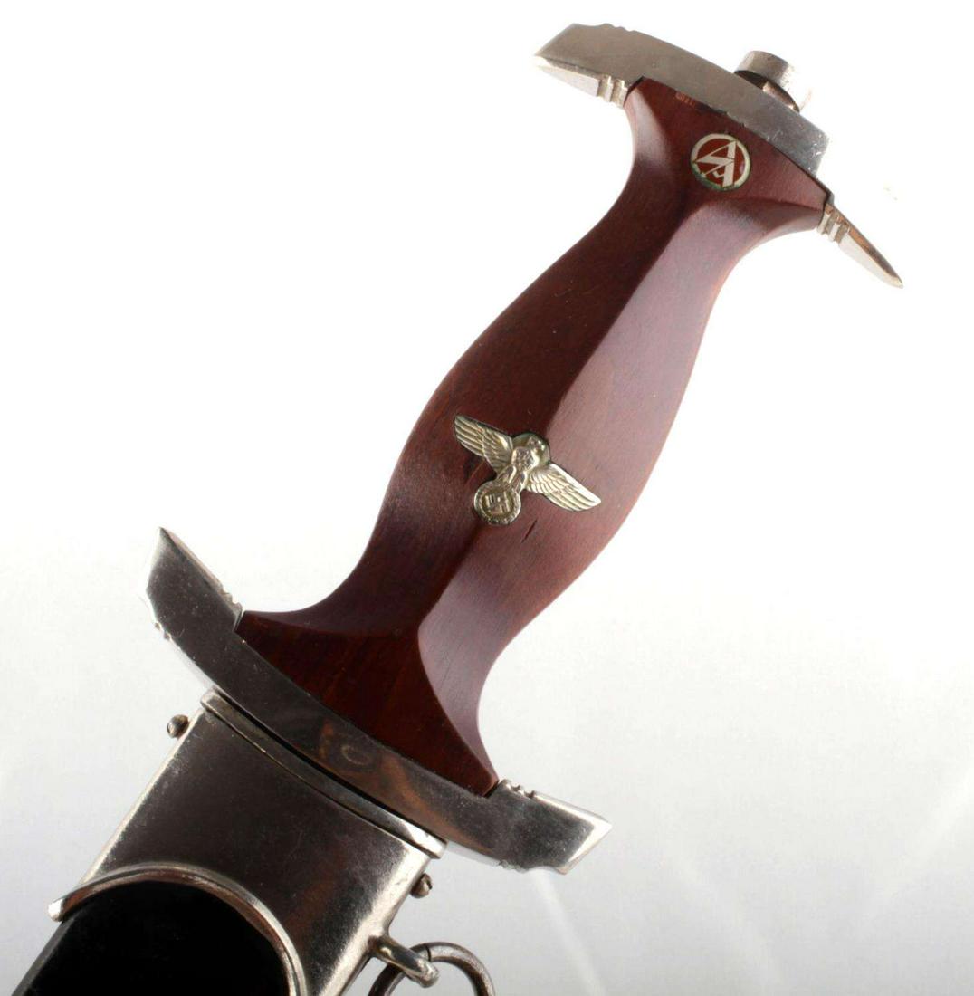 WQWII GERMAN TIHRD REICH RZM SA NSKK DAGGER: WWII German Eickhorn SA dagger and scabbard, measures 14 3/8 inches in scabbard. Obverse of blade is etched with "Alles Fur Deutchland." Reverse marked RZM M7/66 1939 with Eickhorn mark. Blade fits ve