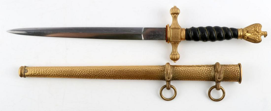 WWII GERMAN REICH KRIEGSMARINE DAGGER & SHEATH: WWII German Reich Kreigsmarine dagger & sheath in good condition. The blade measures 8 13/16 inches long and possesses no markings. Crossguard spacer and sheath locking button are both a little loose.