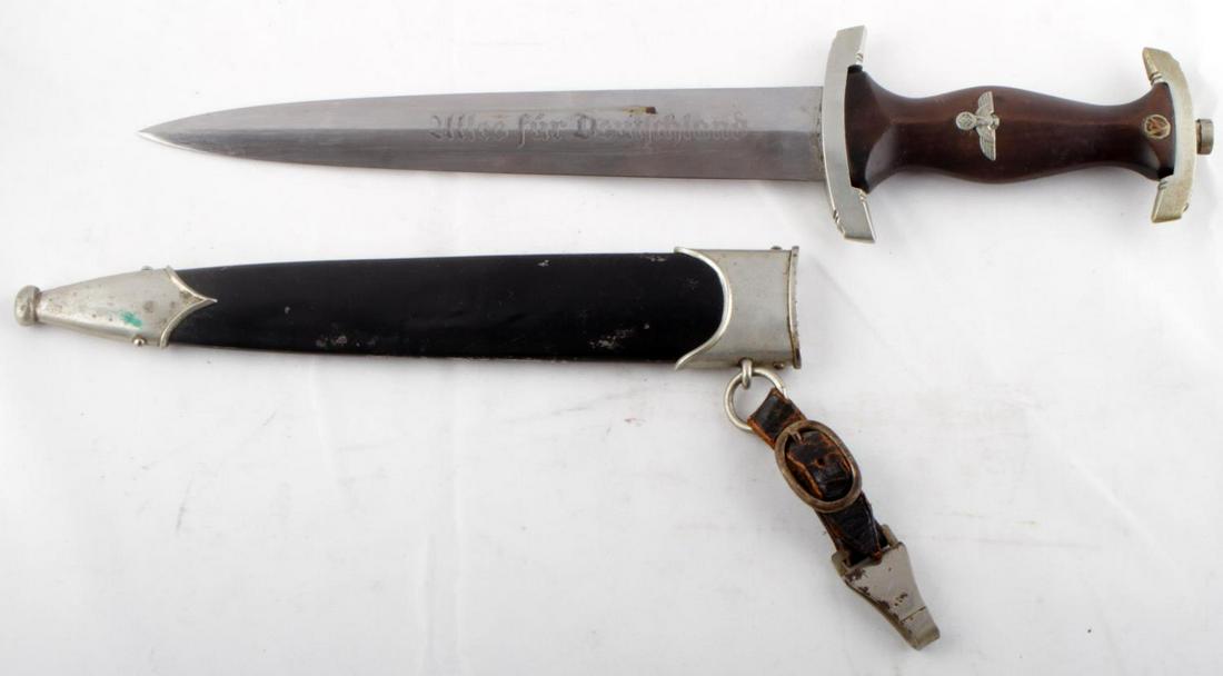 WWII GERMAN REICH SA NSKK DAGGER WITH HANGER: WWII German Reich SA NSKK dagger with leather dagger hanger. Blade possesses some significant scratching and service wear. Crossguards in good condition, each marked "P. & A." on interior, upper cross