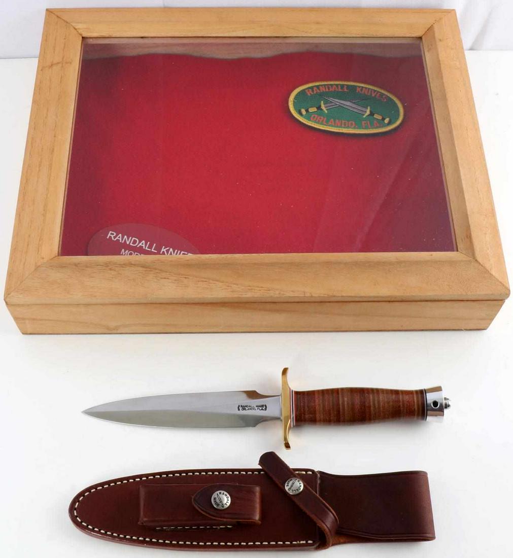 RANDALL KNIVES 6 INCH KNIFE MODEL 2 STILETTO: 6 inch blade. Brass double hilt. Approximately 5 inch leather handle. Duralumin butt cap. This is a heavily made dagger or dirk. The knife is shaped along the lines of a famous British Commando knife,