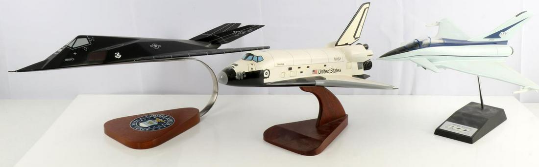3 AIRCRAFT MODELS STEALTH SPACE SHUTTLE RAF JET: Stealth jet made by War Planes measures 20 by 12 inches, has small area at nose of paint loss, RAF Fighter, by British Aerospace, free of damage, 14 by 11 inches, Space Shuttle by Halnet International