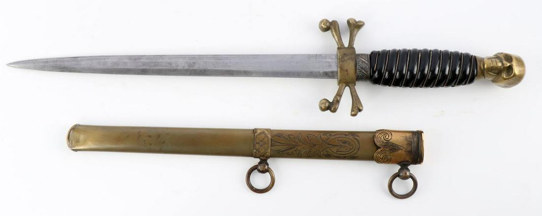 VINTAGE GERMAN MASONIC SKULL W CROSSBONES DAGGER: Vintage Masonic dagger. Steel blade with brass crossguard, pommel, and scabbard. Black celluloid grip. Measures 15 5/8 inches. No marks. Very good condition. This lot has a reserve.