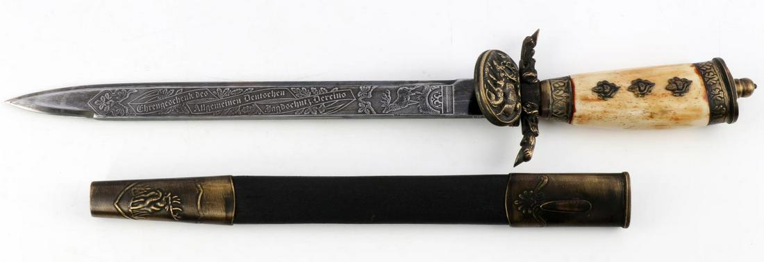 POST WWII GERMAN HUNTSMAN DAGGER STAG GRIP: Steel blade with engraved hunting scenery. Brass clamshell guard, crossguard, and pommel. Leather bound scabbard with brass throat and chape. Solingen marked. Measures 18 inches. This lot has a reserv