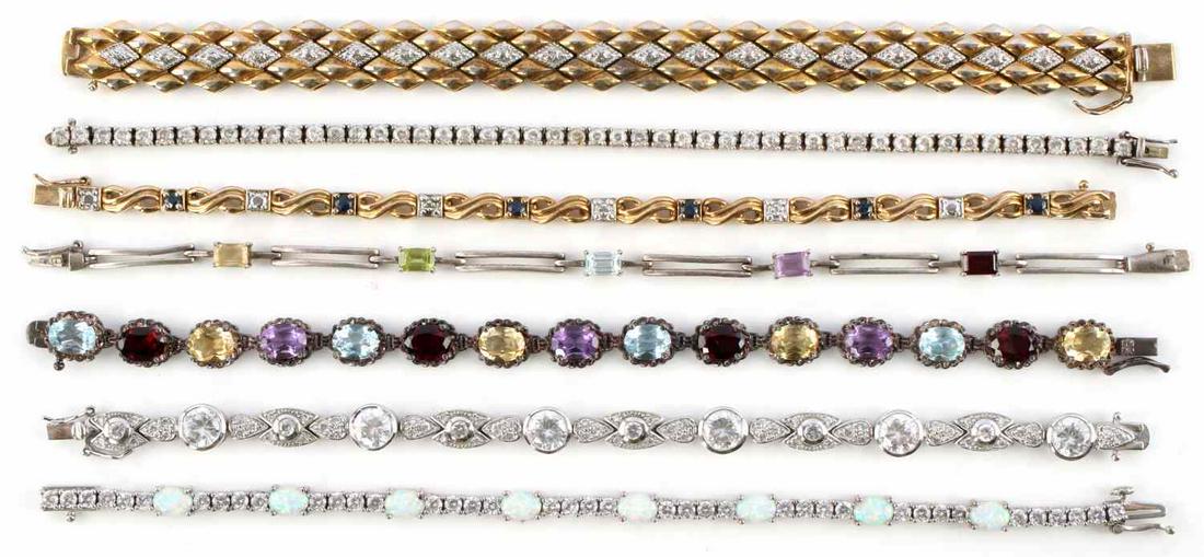 DEALERS LOT STERLING AND GEMSTONE TENNIS BRACELETS: 7 sterling and gemstone bracelets. All are marked 925 and have been acid tested for purity. All in very good condition. Lot weighs 106 grams. This lot has a reserve.