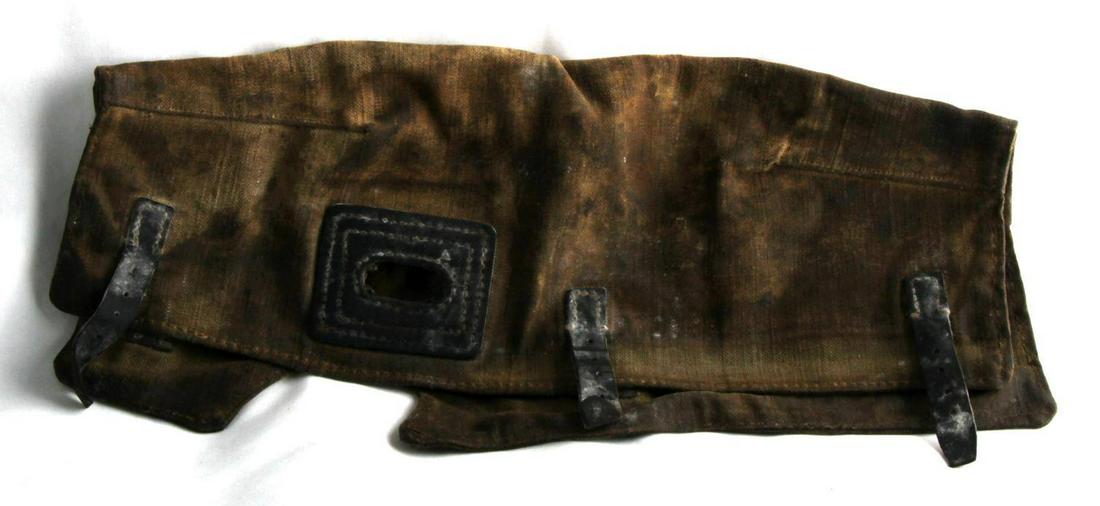 WWII GERMAN MG34 CANVAS RECEIVER COVER: Canvas construction with leather straps, 20 inches long. Soiled and mildew evident.