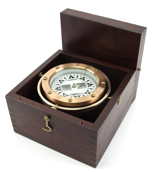 DIRIGO WOOD CASED THREE INCH WET SAILING COMPASS: Gimbaled in a Mahogany wood box, this Dirigo wet compass has a 3 inch card with two degree increments. Box measures 6 by 6 by 4.5 inches. . Condition: Very Good