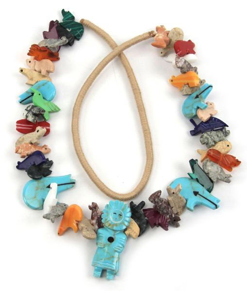 ZUNI GEMSTONE STACKED FETISH SUNFACE NECKLACE: (42) carved semi-precious gemstone foxes, bears, rabbits, frogs and lizards with large carved turquoise Sunface pendant. . Size: 30 inches . Condition: Very good