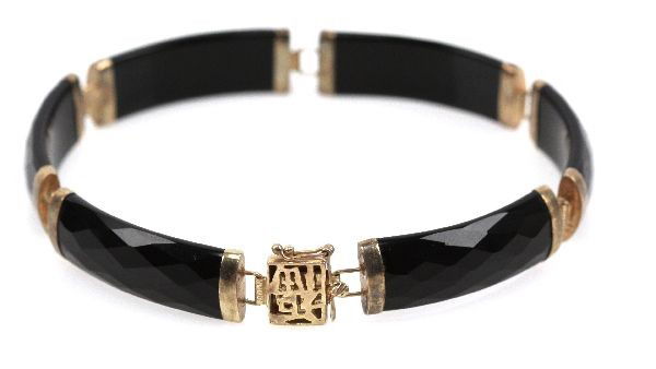 LADIES CHINESE 14K & FACETED OBSIDIAN BRACELET: (6) 26x9mm faceted obsidian cabochons, each linked with 14K yellow gold bezels. . Size: 7.5 inches . Weight: 11.6 g . Condition: Good