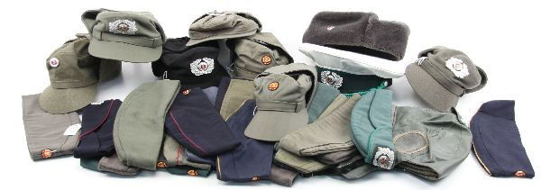 LOT OF 41 EAST GERMAN HATS & CAPS: Lot of 41 East German hats and caps. Include Army, Navy, Police, Border Guard, Civil Defense, Fire department, and more.
