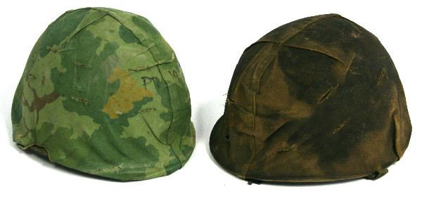 TWO VIETNAM ERA M-1 HELMETS WITH COVERS: M-1 center seam swivel bale helmetS with woodland camouflage covers. Liner on one helmet is dated 1965 on web.