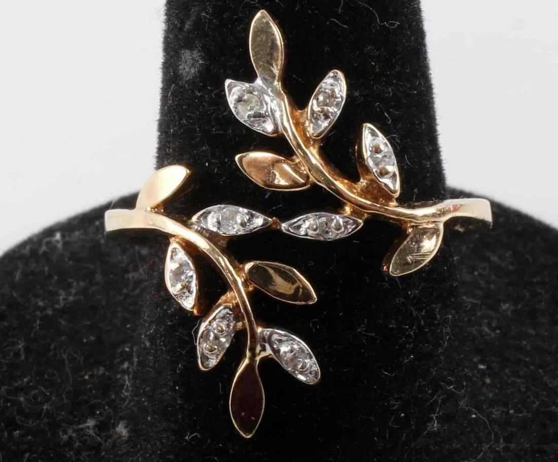 10KP 2 TONE GOLD LEAF RING W MOISSANITE RING: Stamped 10KP (karat plumb) with VIP inside a Diamond shape. Two tones gold with tested moissanite melee accents. Size 8 1/2, total weight 2.2 grams This lot has a reserve.