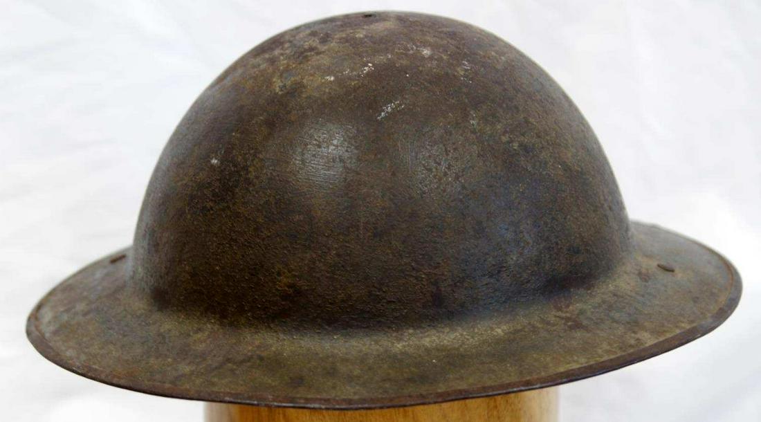 WWI US ARMY MILITARY M1917 HELMET W SWIVEL BALES: WWI U.S. Army Military M1917 Helmet with Swivel Bales, measures approx. 11.5 X 12 X 5 inches. Steel construction, rear rim seam, swivel bales, and two rivets on either side along with an attachment ri