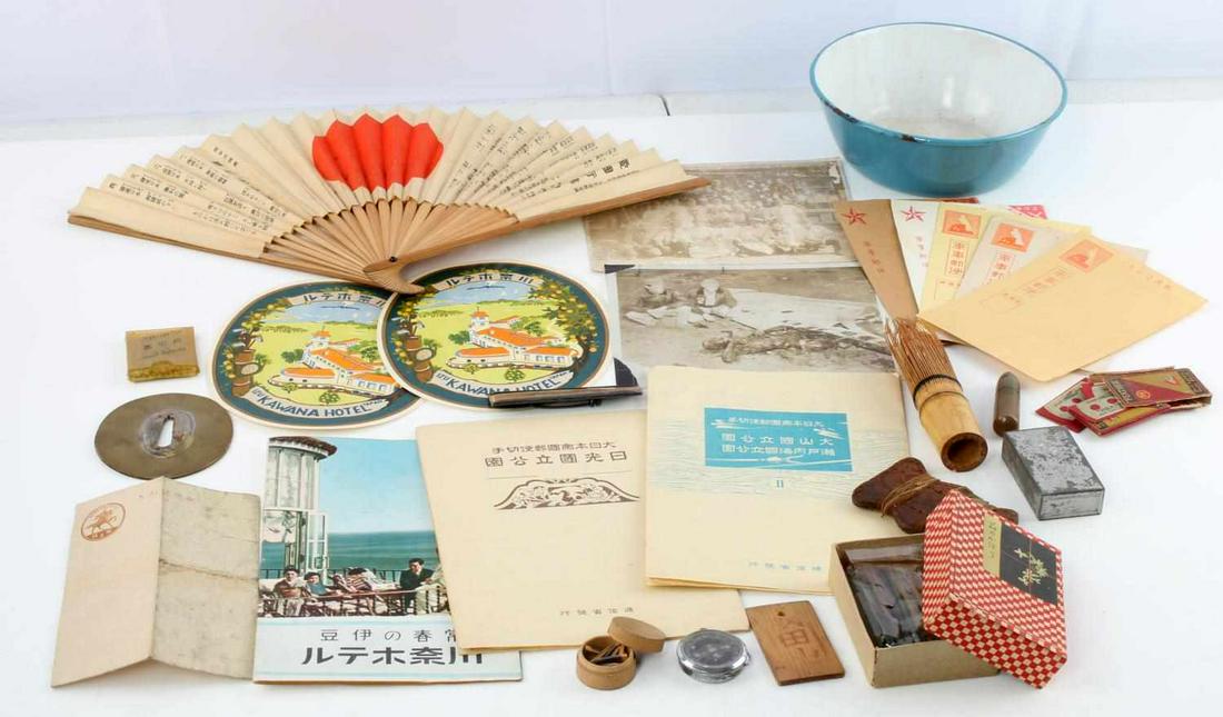 WWII JAPANESE TRINKET GAME SMALL ITEM LOT: Lot includes: mini compass, postcards, tourist pamphlet, 8 uncut stamps, fan, brass tsuba, Yamashita name tag, bamboo shaving brush, stickers, incense, stick game, thread, razor blades, and more. Good