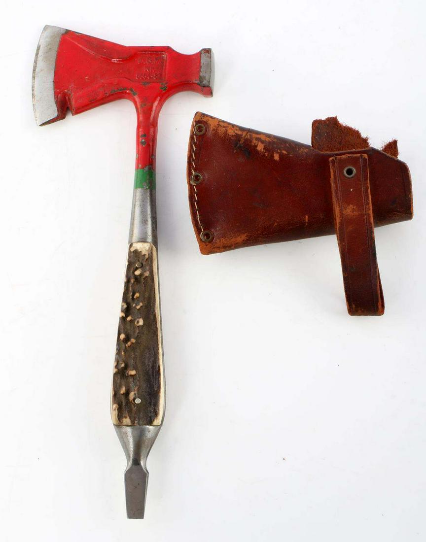 VINTAGE DGM GERMAN MULTI TOOL SURVIVAL HATCHET: Multi-tool features a hatchet, hammer, bottle opener, and screwdriver. Stag grip. Steel construction. Measures 9 inches. Comes with leather sheath.
