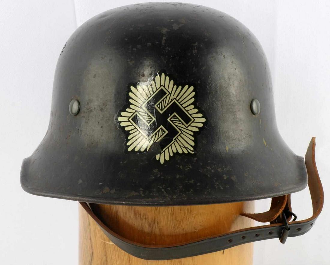 WWII GERMAN REICH LUFTSCHUTZ HELMET: WWII German Reich Luftschutz helmet in good condition, some paint loss and oxidation on helmet shell. Interior 9-fingered liner in good condition and intact, as is chinstrap, and liner string. Sewing 