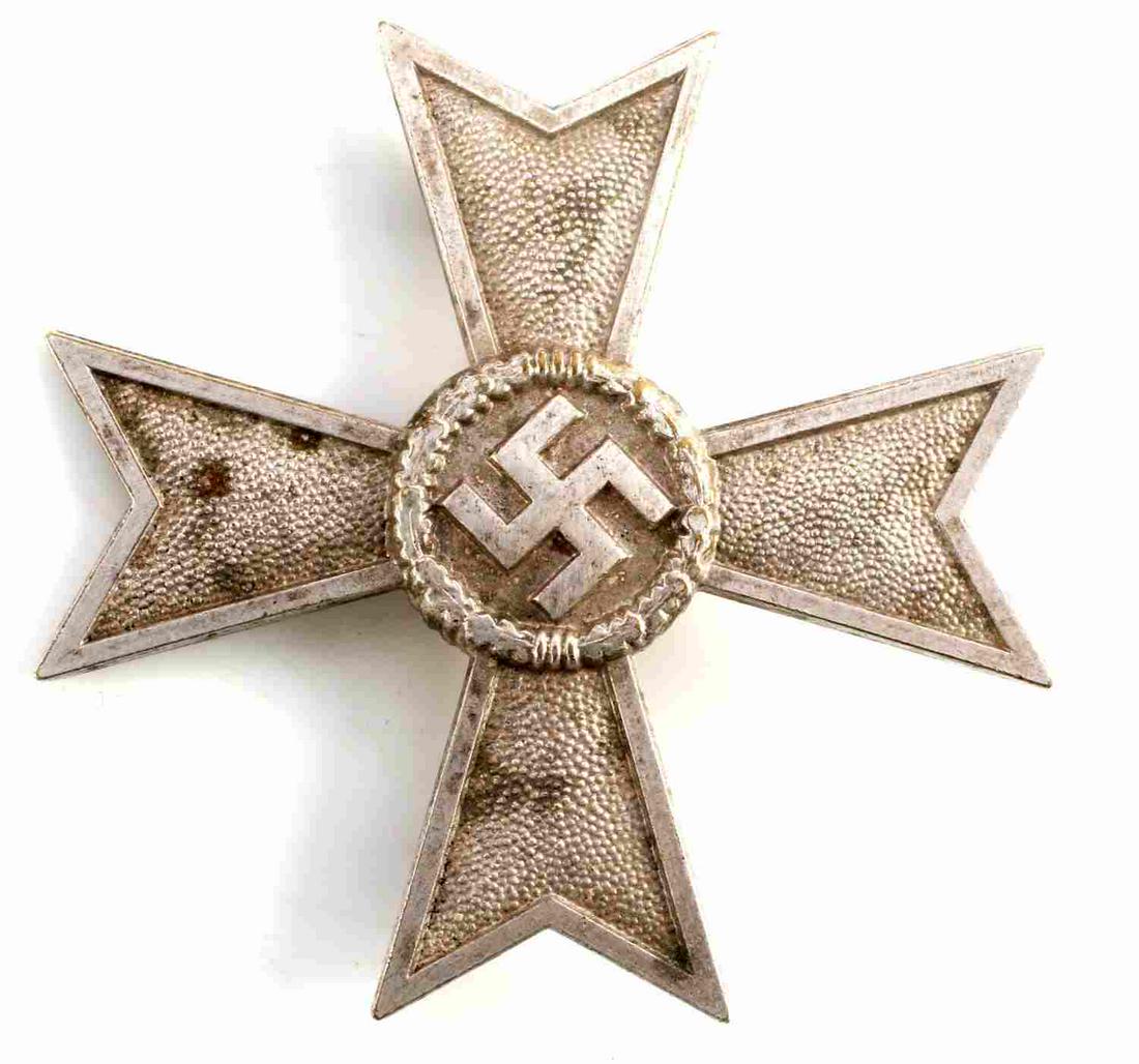 WWII GERMAN REICH FIRST CLASS WAR MERIT CROSS: German Reich first class war merit cross. Coke bottle pin type marked L15. Measures 2 1/8 inches. Very good condition.