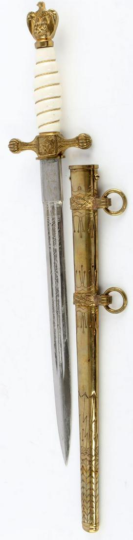 WWII THIRD REICH GERMAN NAVY OFFICERS DAGGER: Features a finely engraved 10 inch sharp blade with WKC maker mark at ricasso, brass fittings and scabbard, with synthetic grip. Unauthenticated, sold as is.