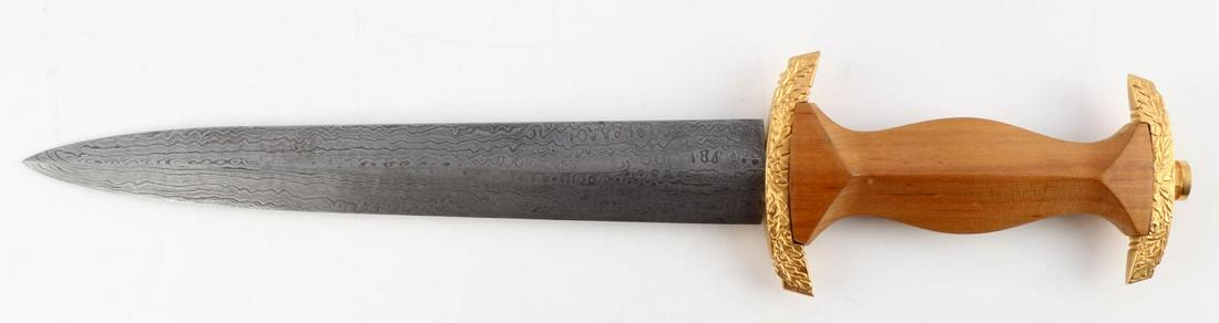 WWII GERMAN NPEA DAMASCUS DAGGER UNMARKED: Features a 8 7/8 inch Damascus blade, collar absent, light wood grip, and gold tone oak leaf fittings. Unknown maker. Good condition. Unauthenticated, sold as is.