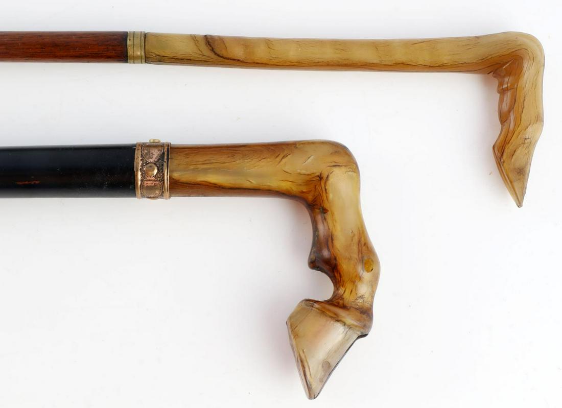 ANTIQUE HORN HORSE HOOF WALKING STICK CANE LOT: Two exceptional examples, lesser cane has horn hoop to brass wrap to copper ferrule tip, 34 inches overall. The greater of the 2 has very nice horn hoof grip, gold wrap, ebonized shaft tp original fer