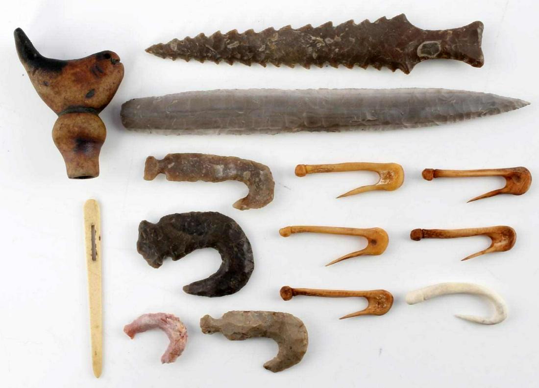 ARCHAIC BONE & LITHIC FISHHOOKS & 2 ARROWHEADS: Contained in 8 by 6 inch Riker mount, stone fish clay pipe 2 1/2 by 2 inch, 4 lithic fishhooks, 6 bone, awl, and 2 5 plus inch lance points.