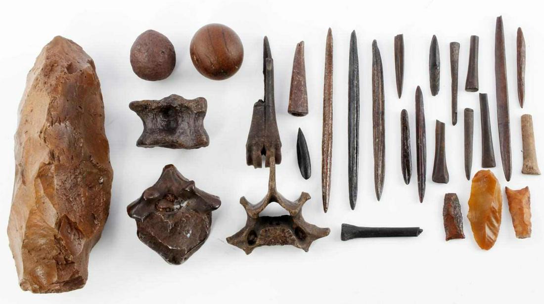 FLORIDA INDIAN GAME BALL ARROWHEAD TOOL LOT: Lot features a large 9 1/4 inch stone hammer, two 1 3/4 inch game balls, large vertebrae, variety of small pins and bones, and three 1.5 inch arrowheads. Found in the Chipola river with very good pati